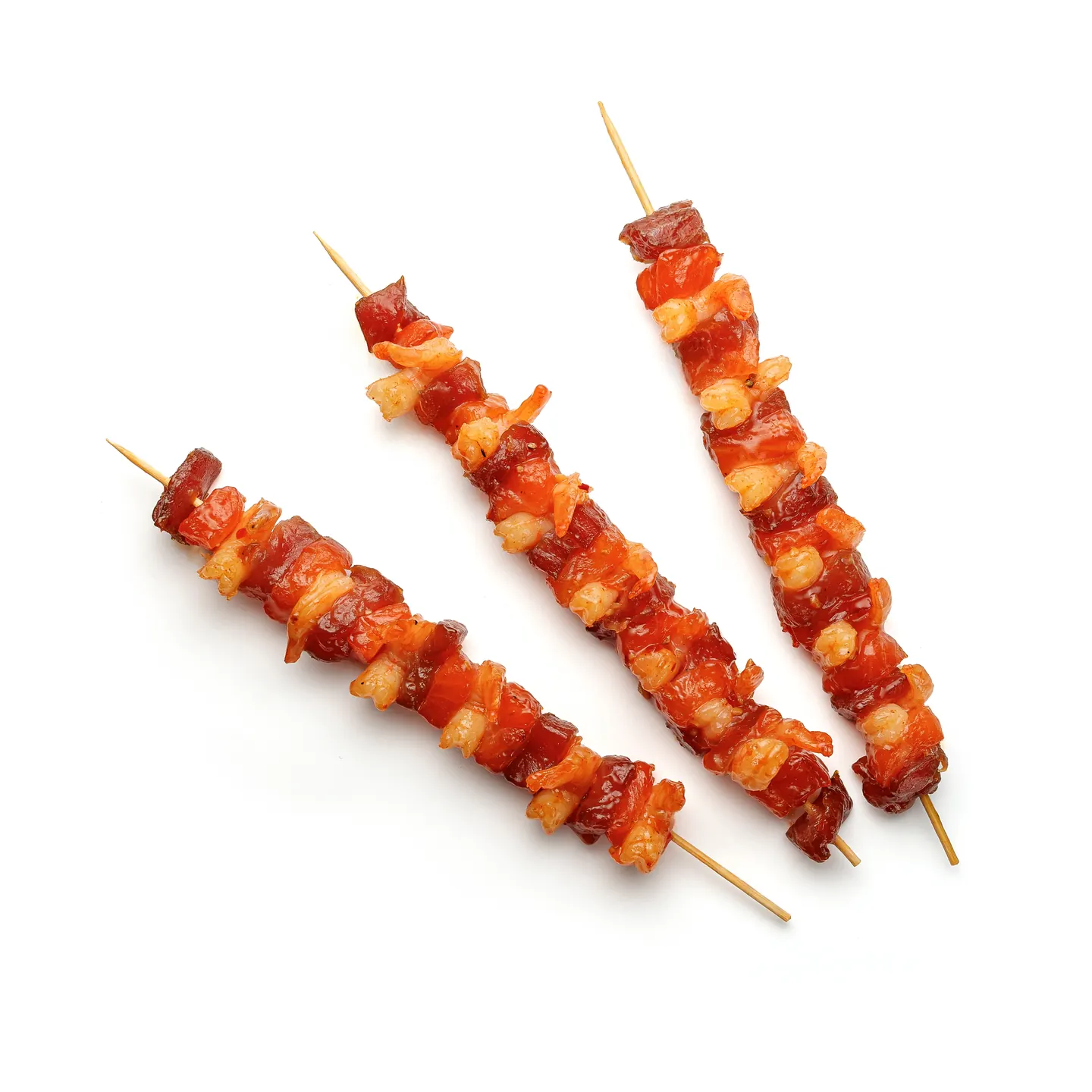 Photograph of Skewers with salmon, tuna and prawns